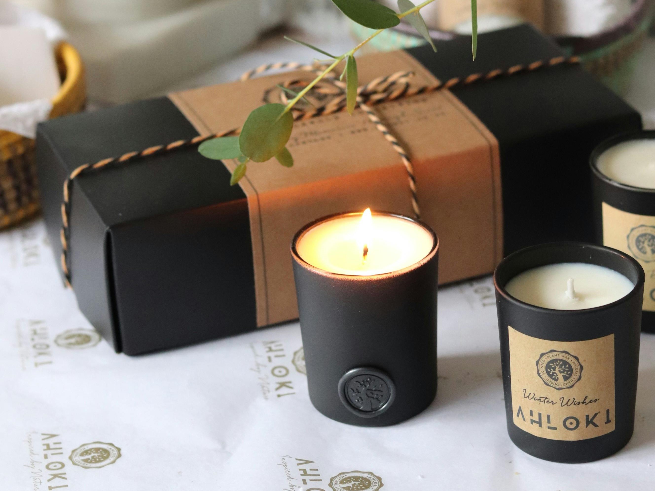 A gift-wrapped candle packaging box